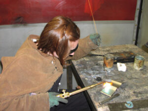 Angela welding at The Evergreen State College